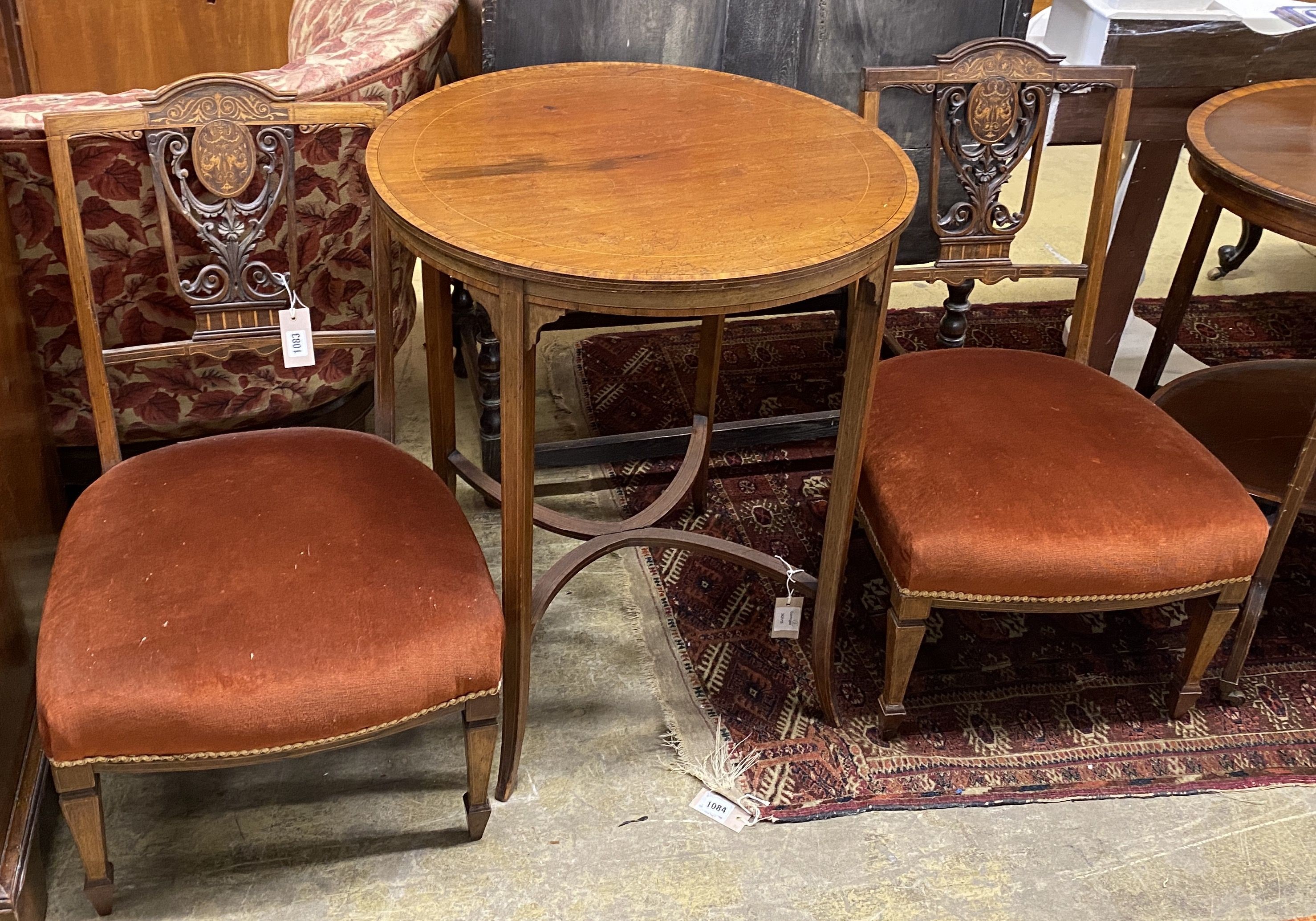 A pair of Edwardian marquetry inlaid mahogany drawing room side chairs and an Edwardian satinwood banded mahogany circular topped occasional table, diameter 60cm, height 71cm (3)